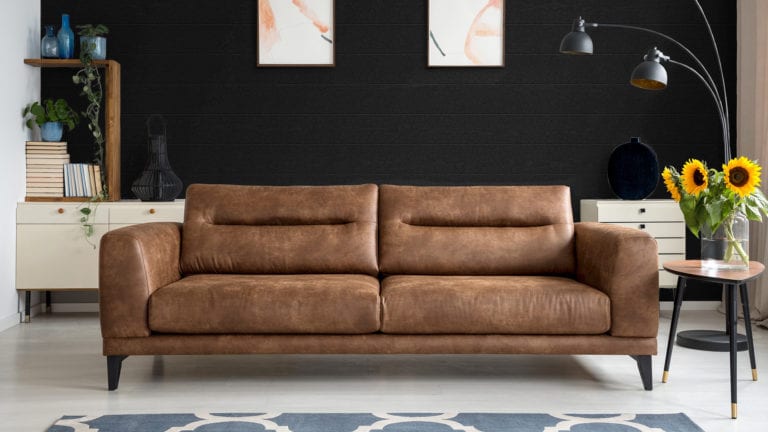 Russin_Banner_Siding_Thermory-Cladding_Ignite-Spruce-Leather-Couch