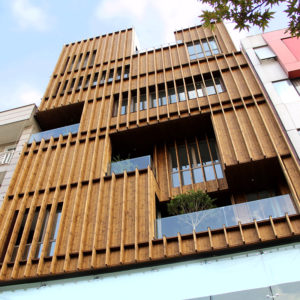 This image depicts an exterior view of a building with pine siding.