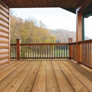 This image depicts a covered, warm wooden deck overlooking the woods.